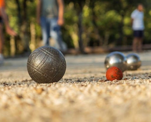 Playing Boules Game / Petanque in France